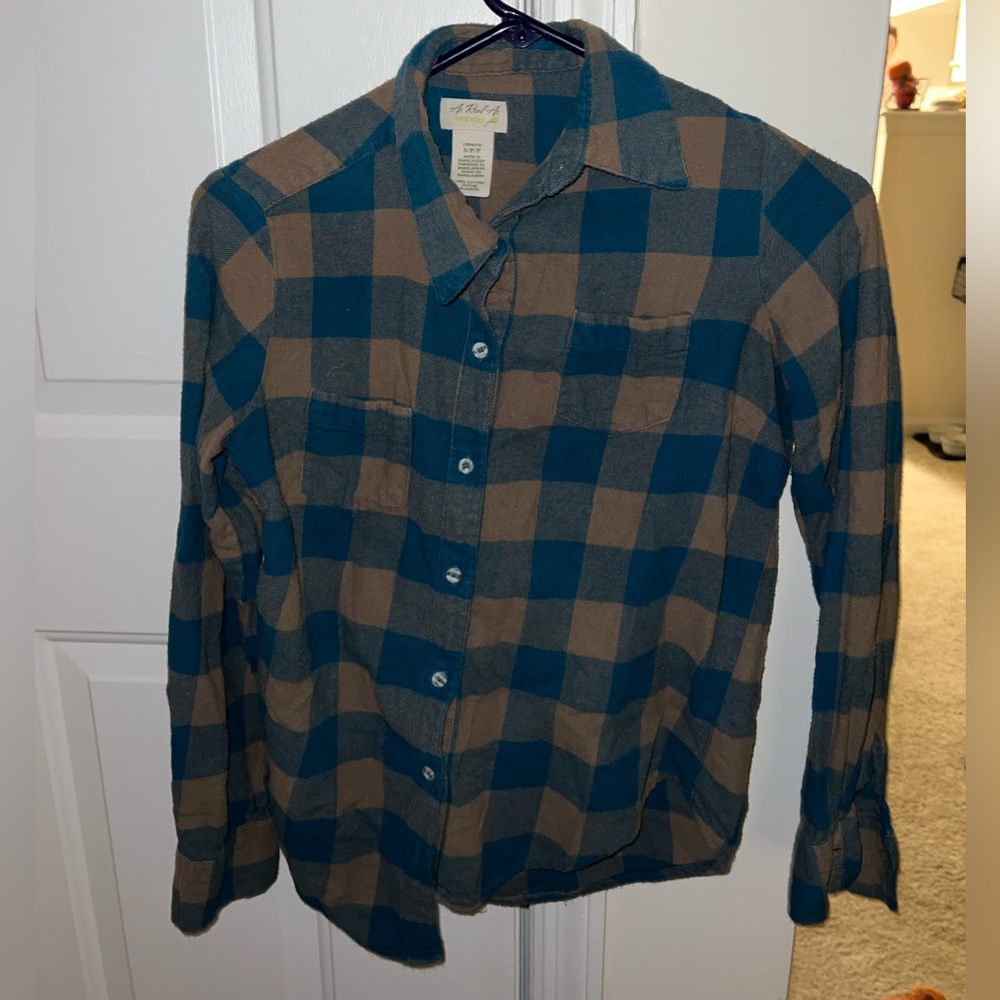 Woman’s small blue and grey flannel top